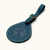 Navy blue leather luggage tag with embossed globe and airplane design, travel gift for frequent flyers