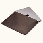 Coffee color full-grain leather MacBook Air sleeve, customizable, shown partially open with laptop inside
