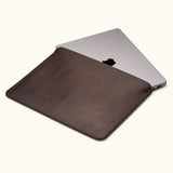 Coffee color full-grain leather MacBook Air sleeve, customizable, shown partially open with laptop inside