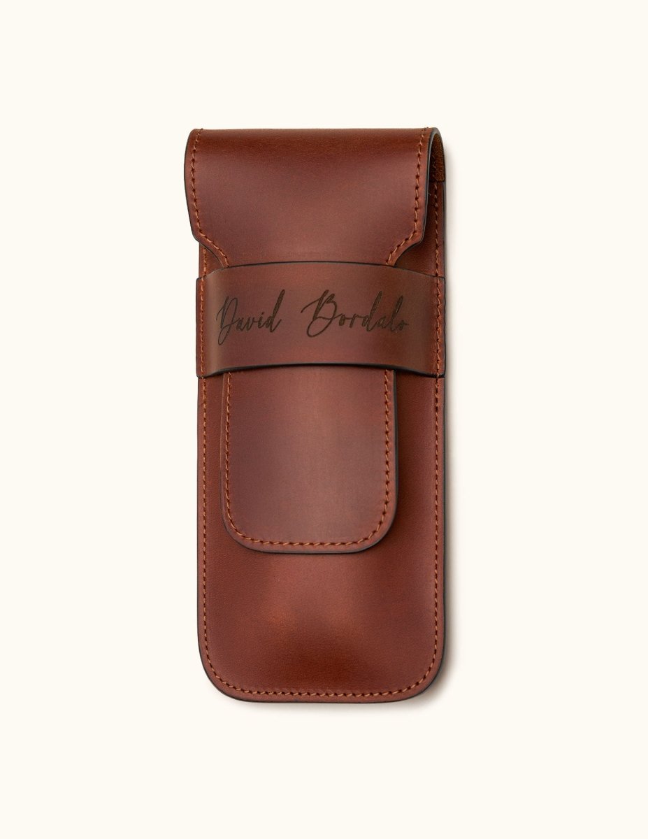 Chestnut brown leather double cigar case personalized with the name "David Bordalo", featuring a flap closure and premium full-grain leather craftsmanship
