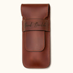 Chestnut brown leather double cigar case personalized with the name "David Bordalo", featuring a flap closure and premium full-grain leather craftsmanship