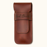 Chestnut brown leather double cigar case personalized with the name "David Bordalo", featuring a flap closure and premium full-grain leather craftsmanship
