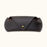Closed view of handcrafted dark brown Crazy Horse leather sunglasses case with snap button closure