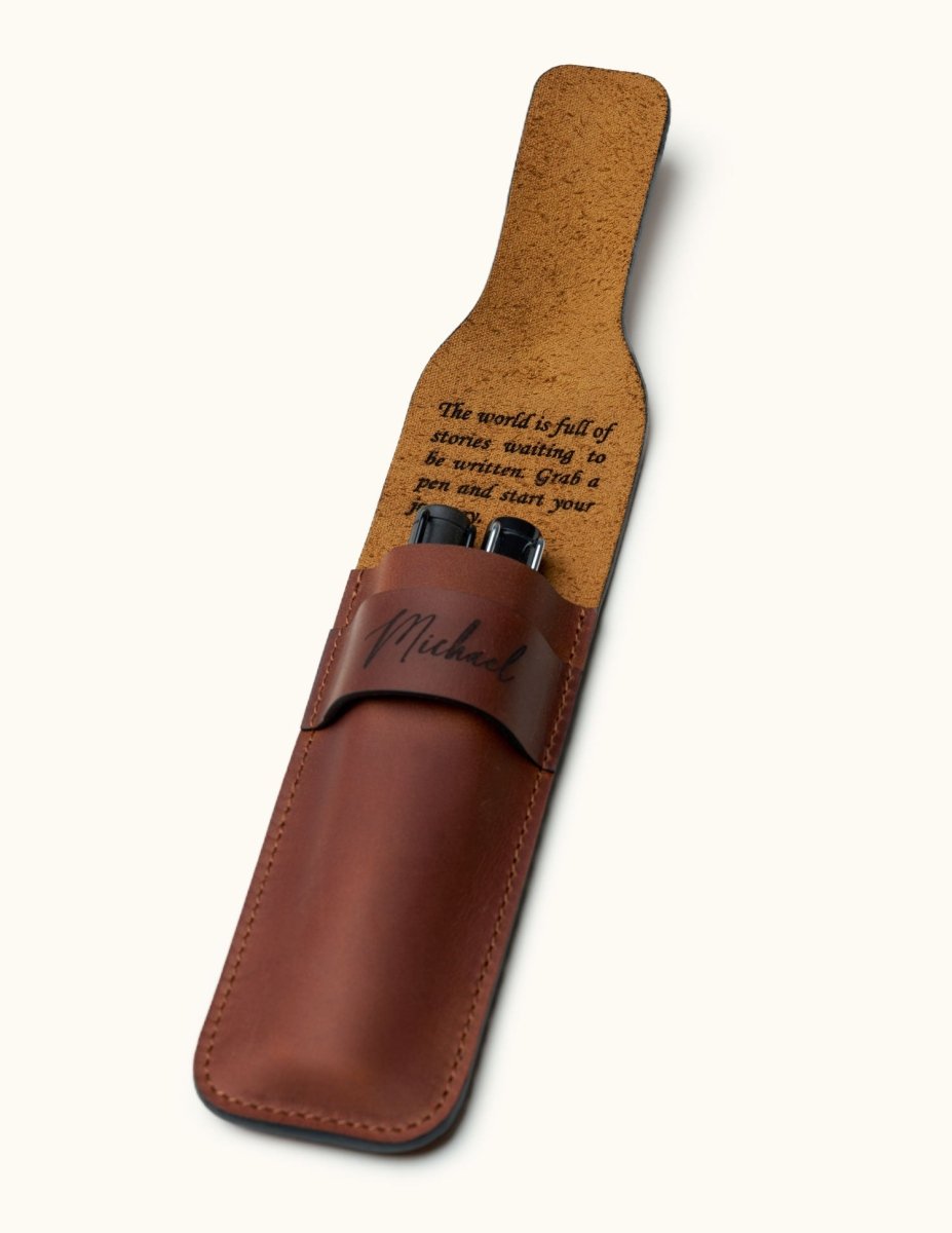 Double pen leather case with custom engraved message on the inner flap. Holds two fountain pens and features name engraving on the front
