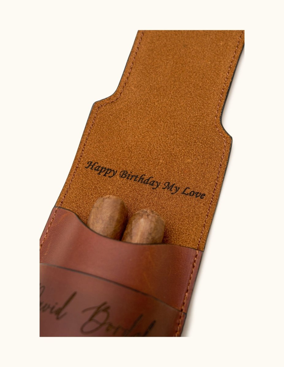 Close-up of a personalized leather double cigar case with inner flap engraving that reads "Happy Birthday My Love", demonstrating hidden custom message option