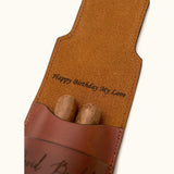 Close-up of a personalized leather double cigar case with inner flap engraving that reads "Happy Birthday My Love", demonstrating hidden custom message option