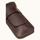 Close-up of a dark brown full-grain leather double cigar case without engraving, highlighting the smooth finish, clean stitching, and minimalist design