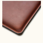 Close-up of corner stitching and texture on customizable full-grain leather MacBook Air case