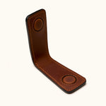 Close-up interior view of brown leather magnetic money clip showing strong built-in magnets and hand-stitched details