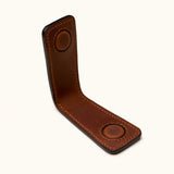 Close-up interior view of brown leather magnetic money clip showing strong built-in magnets and hand-stitched details