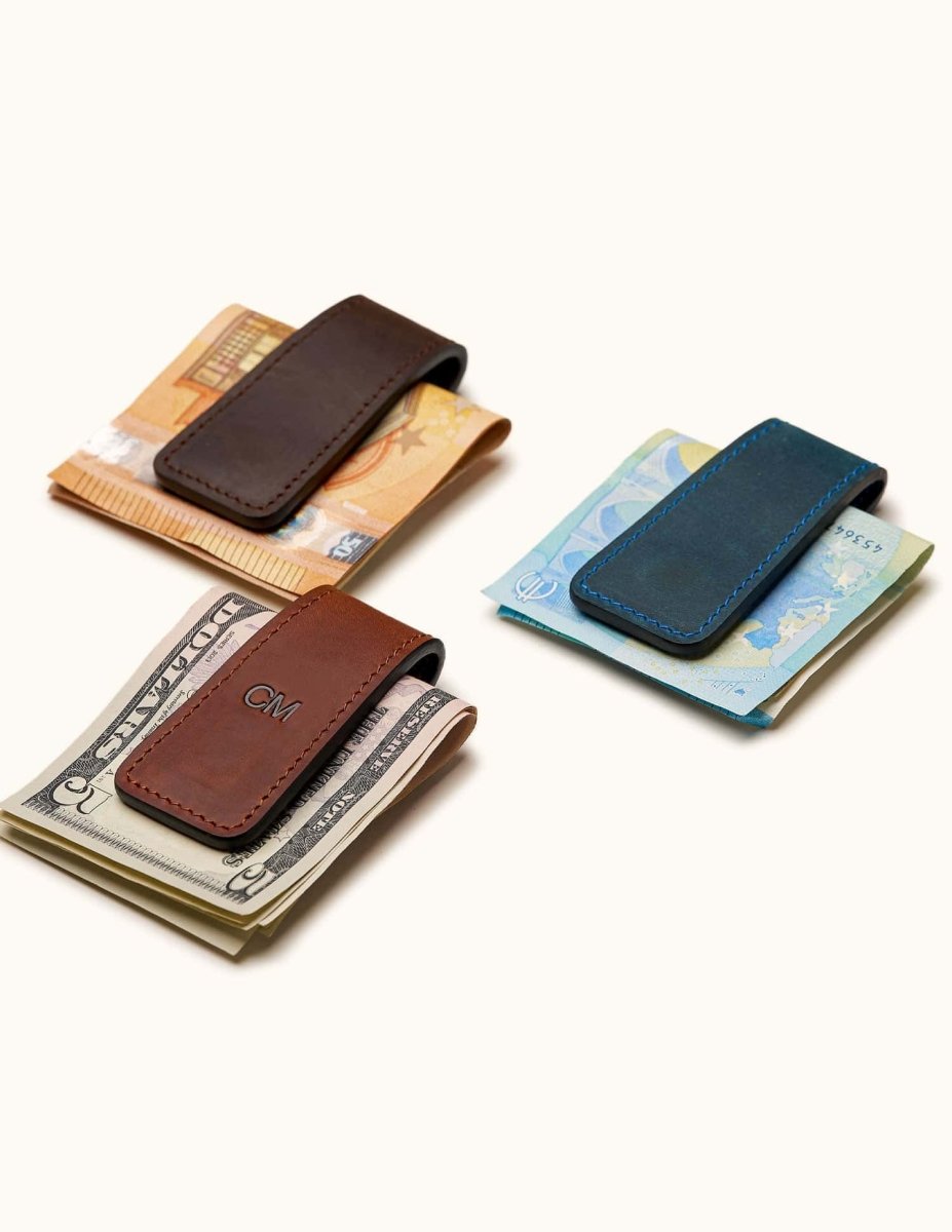 Three leather magnetic money clips in Vintage Brown, Navy, and Coffee – personalized cash holders for different currencies