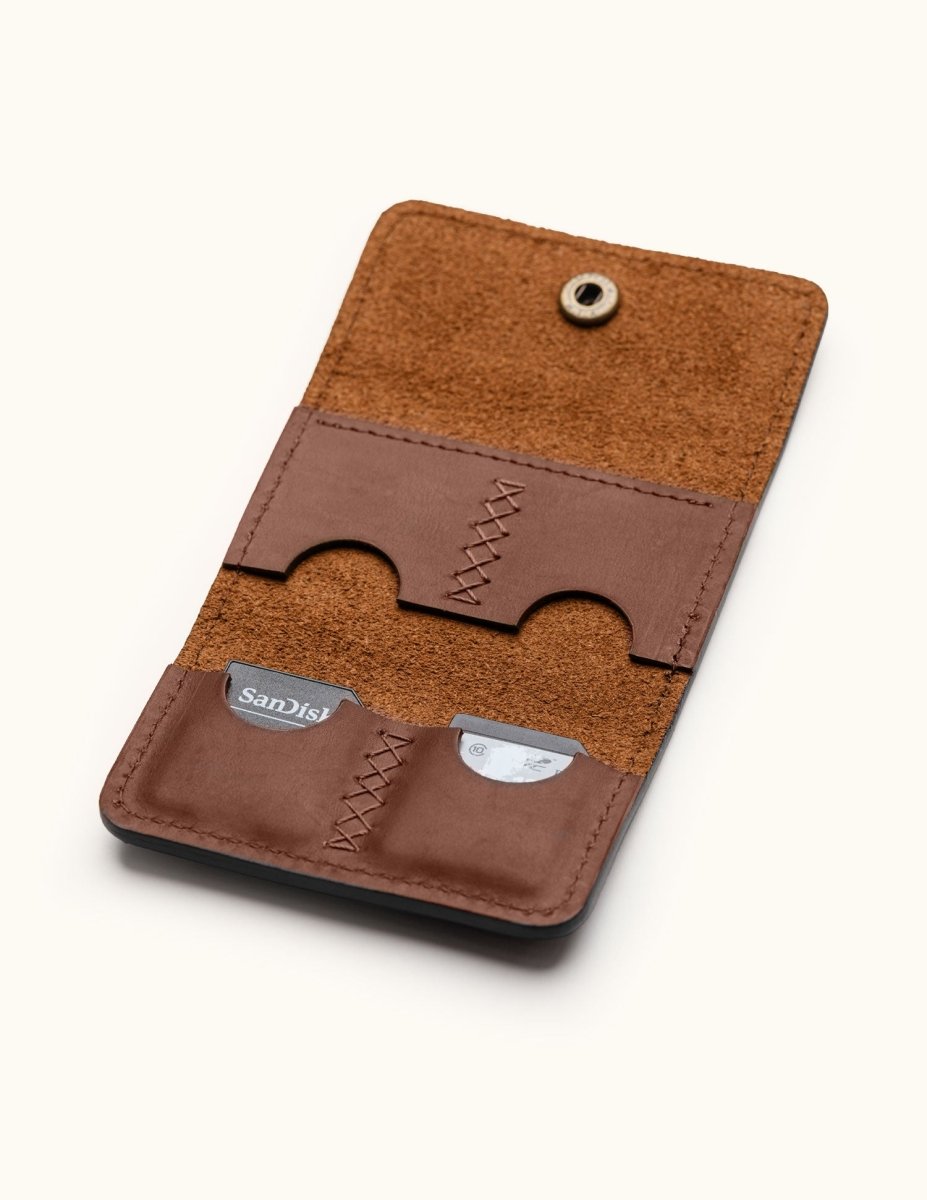 Vertical view of handcrafted leather Micro SD card holder with four stitched pockets for memory card storage and protection