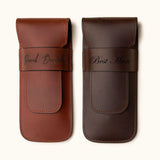 Two personalized full-grain leather double cigar cases in chestnut and dark brown, engraved with names and titles like "David Bordalo" and "Best Man" — a refined gift for groomsmen or cigar aficionados