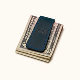 Navy blue leather magnetic money clip with engraved initials CM – stylish and compact cash holder