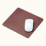 Small personalized leather mouse pad with name engraving and Apple Magic Mouse on top
