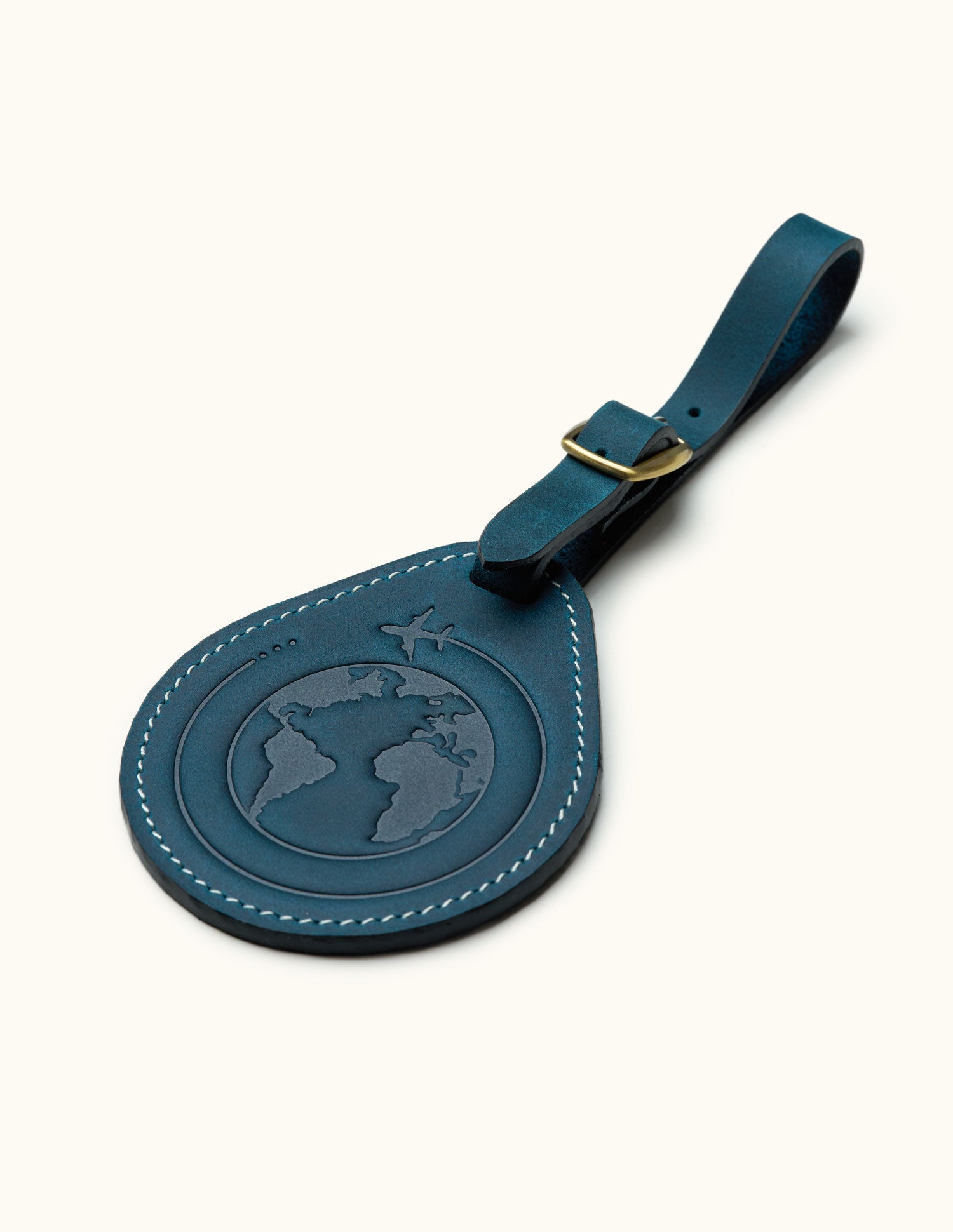 Navy blue leather luggage tag with embossed globe and airplane design, travel gift for frequent flyers