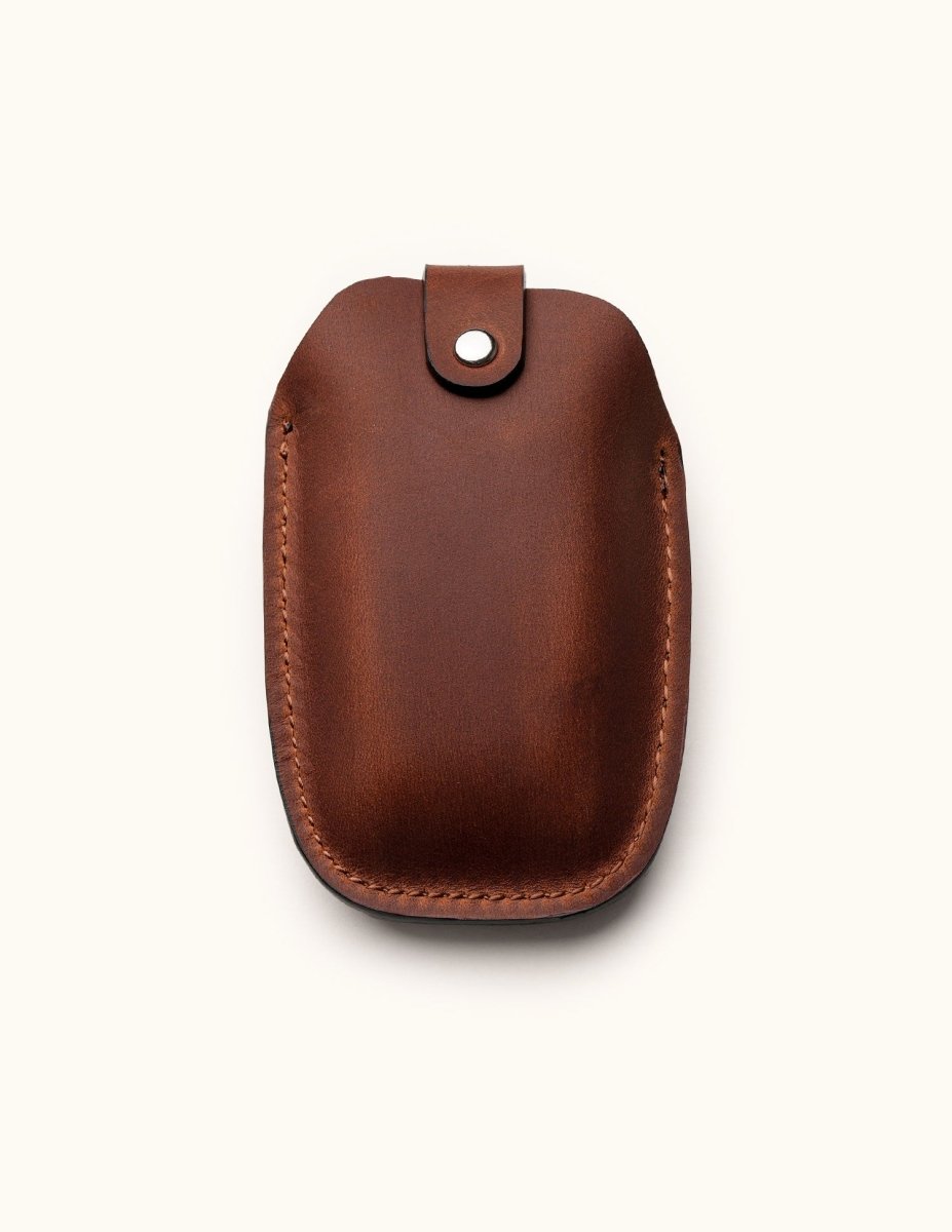 Back view of brown leather key fob case for BMW smart key with snap closure