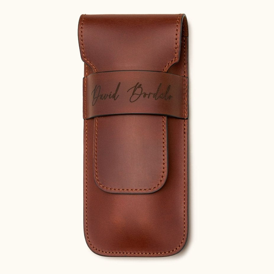 Chestnut brown leather double cigar case personalized with the name "David Bordalo", featuring a flap closure and premium full-grain leather craftsmanship