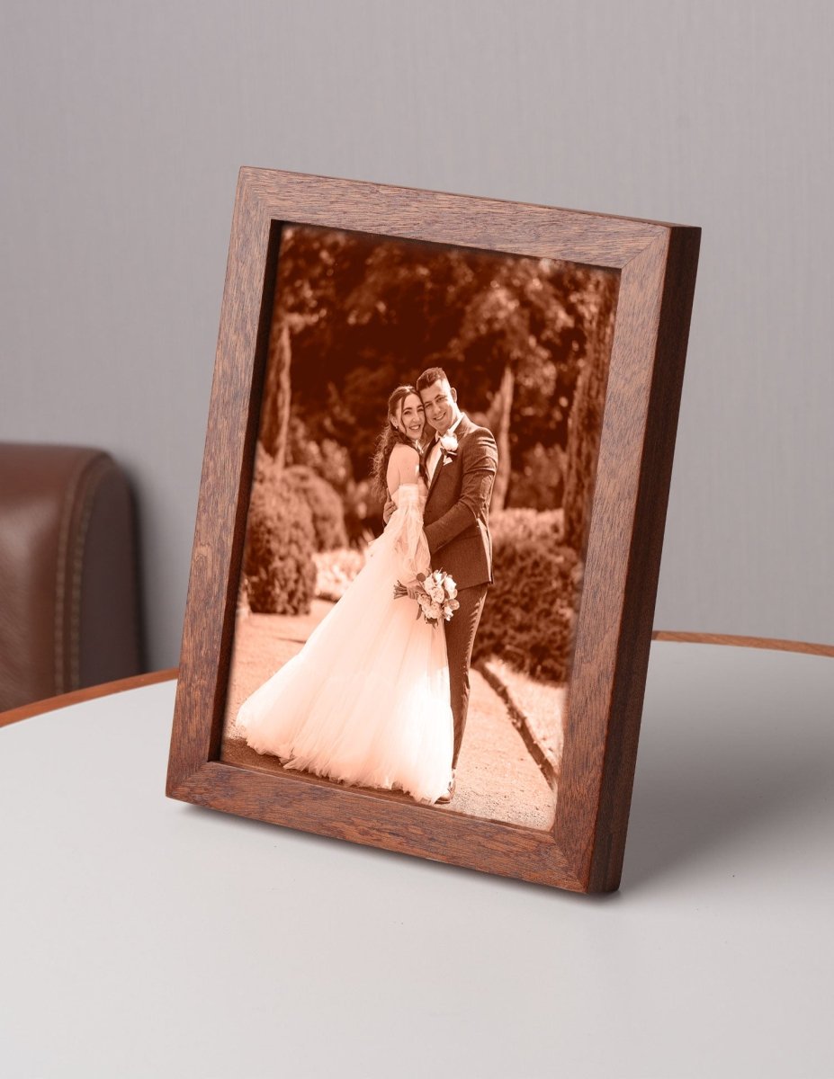 Side view of a custom laser-engraved leather wedding photo in a wooden frame, featuring a bride and groom — a meaningful 3rd anniversary or wedding keepsake gift