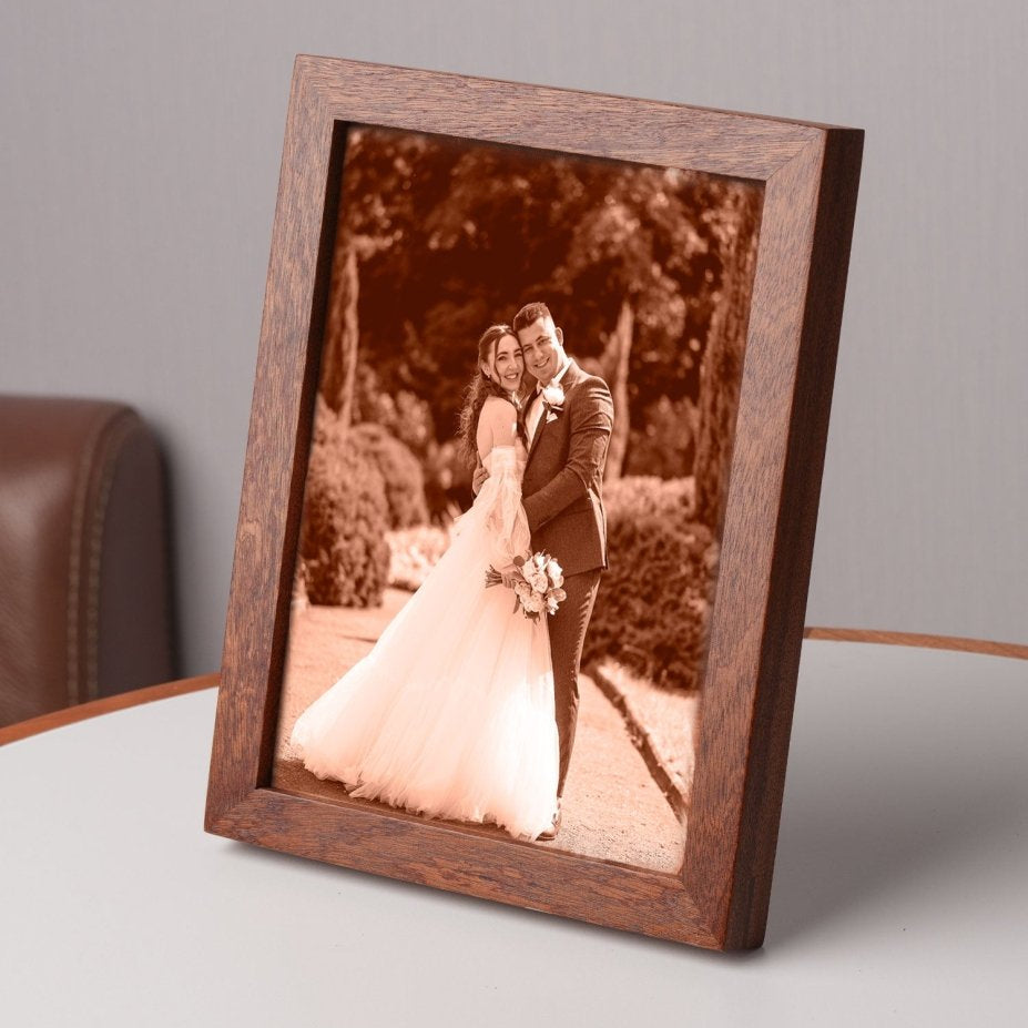 Side view of a custom laser-engraved leather wedding photo in a wooden frame, featuring a bride and groom — a meaningful 3rd anniversary or wedding keepsake gift