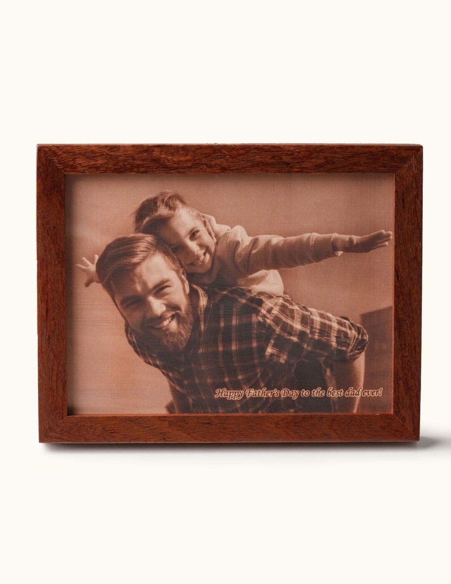 Custom laser-engraved leather photo of a smiling father giving his daughter a piggyback ride, with the engraved message “Happy Father’s Day to the best dad ever” — a heartfelt Father’s Day gift