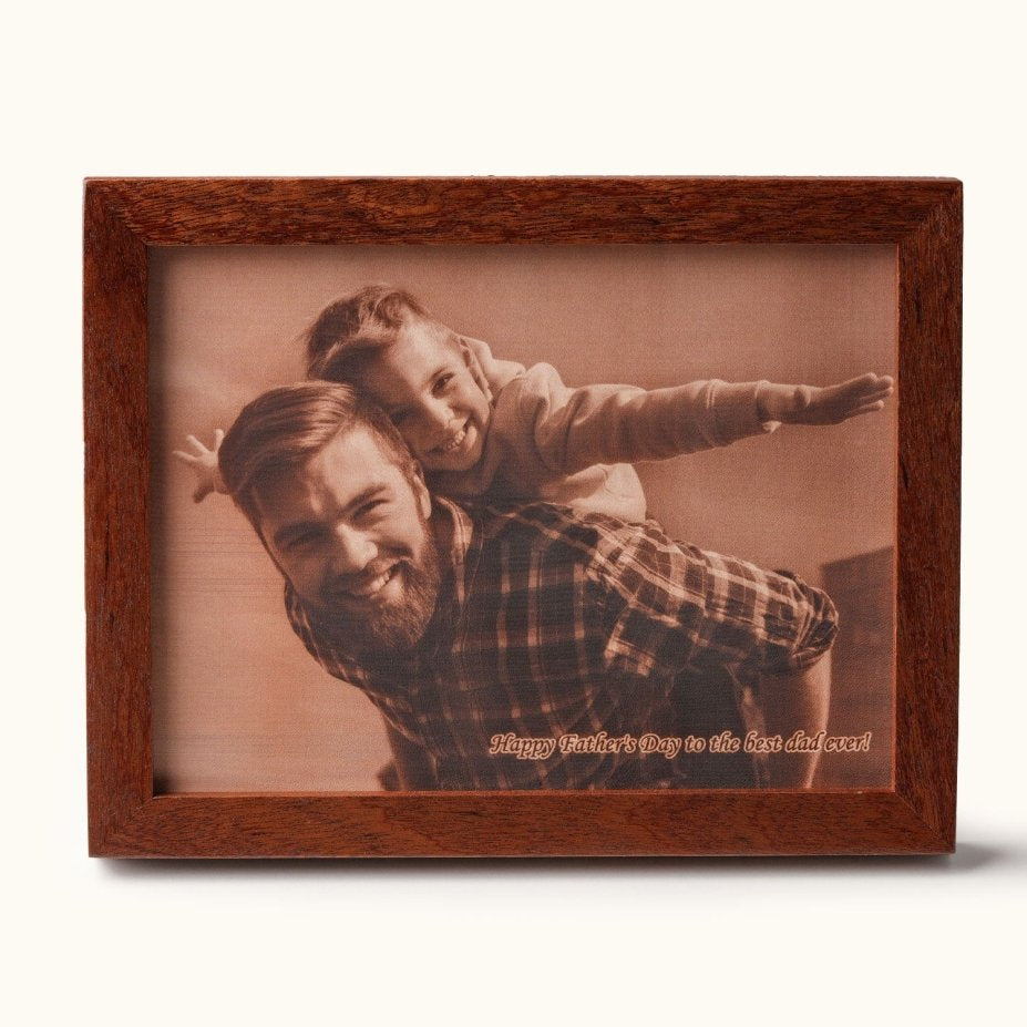Custom laser-engraved leather photo of a smiling father giving his daughter a piggyback ride, with the engraved message “Happy Father’s Day to the best dad ever” — a heartfelt Father’s Day gift