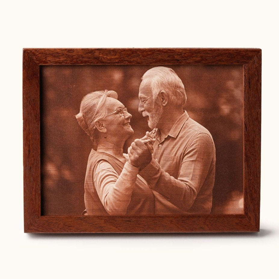 Laser-engraved leather portrait of a smiling couple dancing, framed in wood — a heartfelt 3rd wedding anniversary gift celebrating love and lasting memories