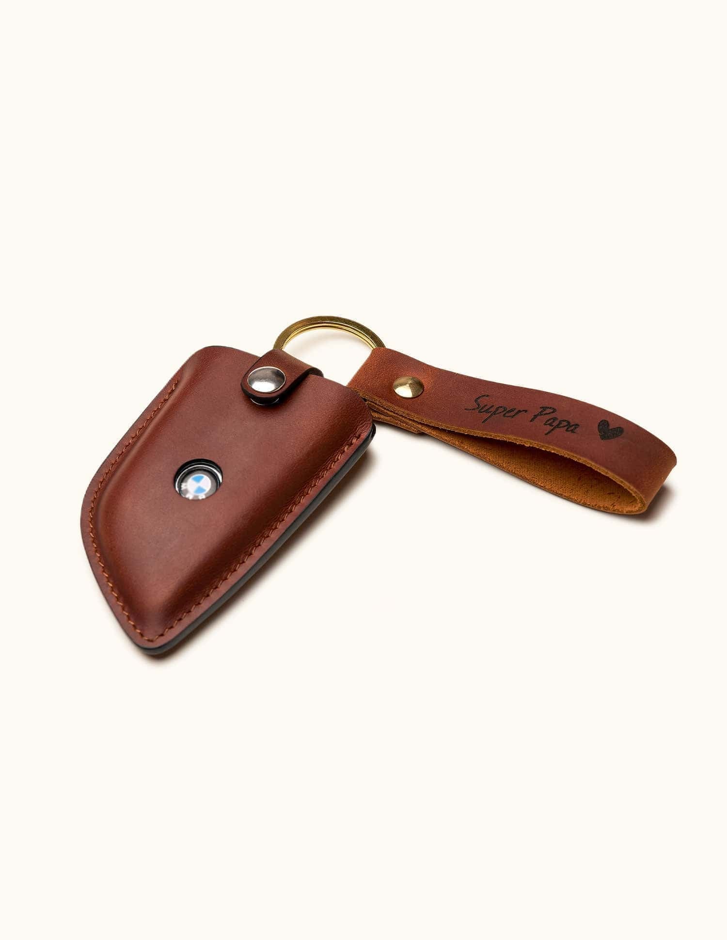 Brown leather BMW key holder with keyring and strap engraved with "Super Papa" and a heart symbol