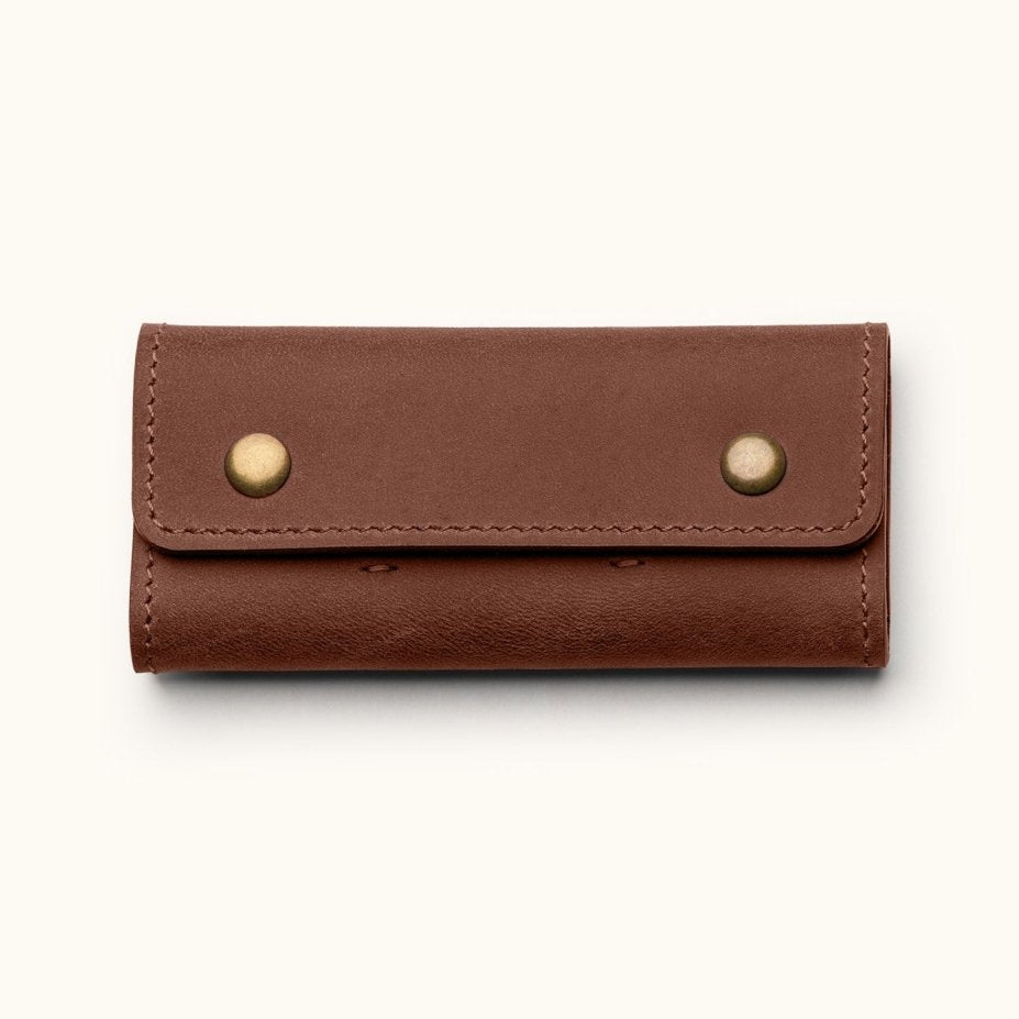 Handmade leather guitar pick holder case with customizable name option, featuring brass snap buttons