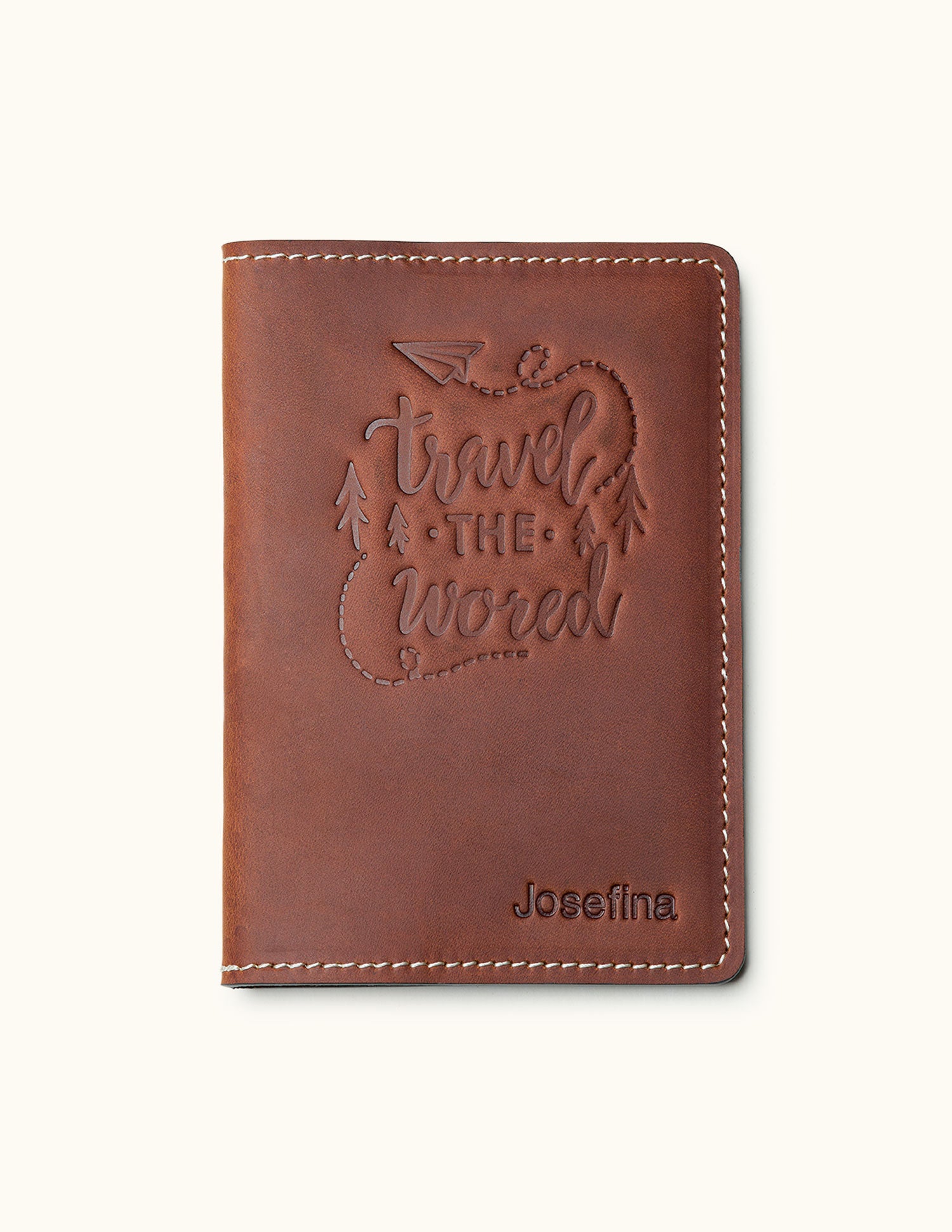 Brown leather passport cover with 'Travel the World' design and personalized name – ideal for travelers