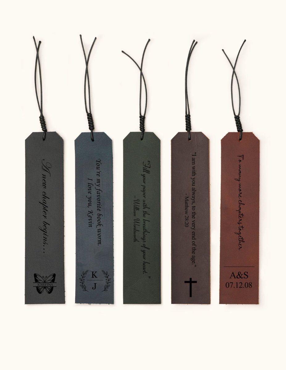 Five personalized leather bookmarks in different colors, each engraved with custom quotes, initials, or dates, with decorative tassel cords on top