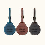 Custom engraved leather luggage tags in blue, brown, and black with name, address, and phone number
