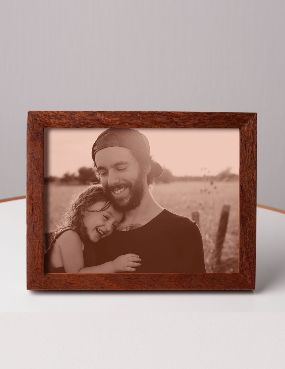 Custom laser-engraved leather photo of a smiling father and daughter embracing outdoors, framed in wood — a touching personalized gift for Father’s Day or dad’s birthday
