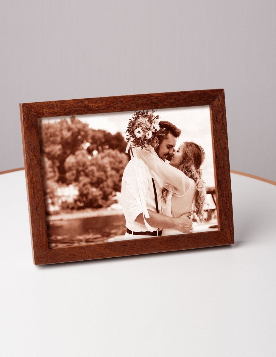 Romantic wedding photo of a couple embracing and smiling, laser-engraved on leather and framed in wood — a heartfelt personalized gift for a 3rd anniversary or wedding keepsake
