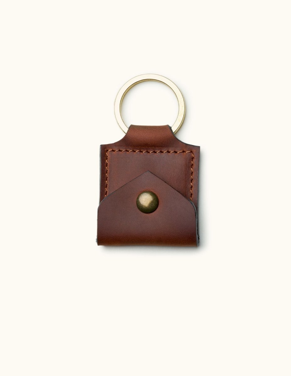 Square brown leather guitar pick holder keychain with brass snap button and stitched edges