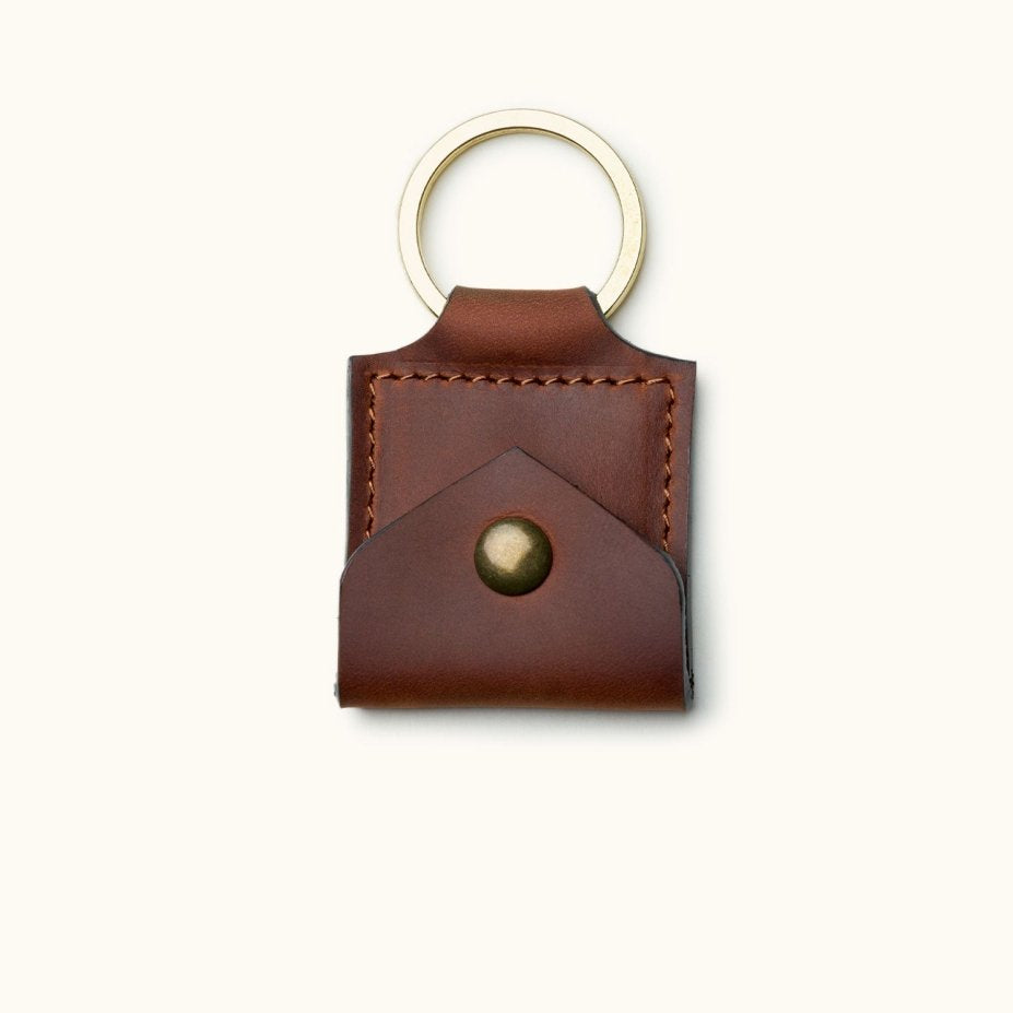 Square brown leather guitar pick holder keychain with brass snap button and stitched edges